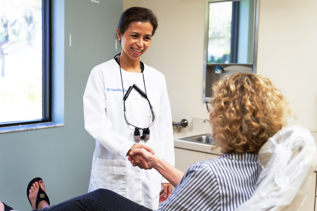 Peak Dental instructors guiding students in the training lab